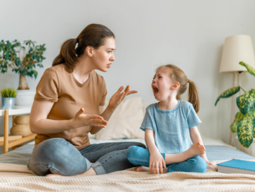 Mother is scolding her child girl, family relationships.