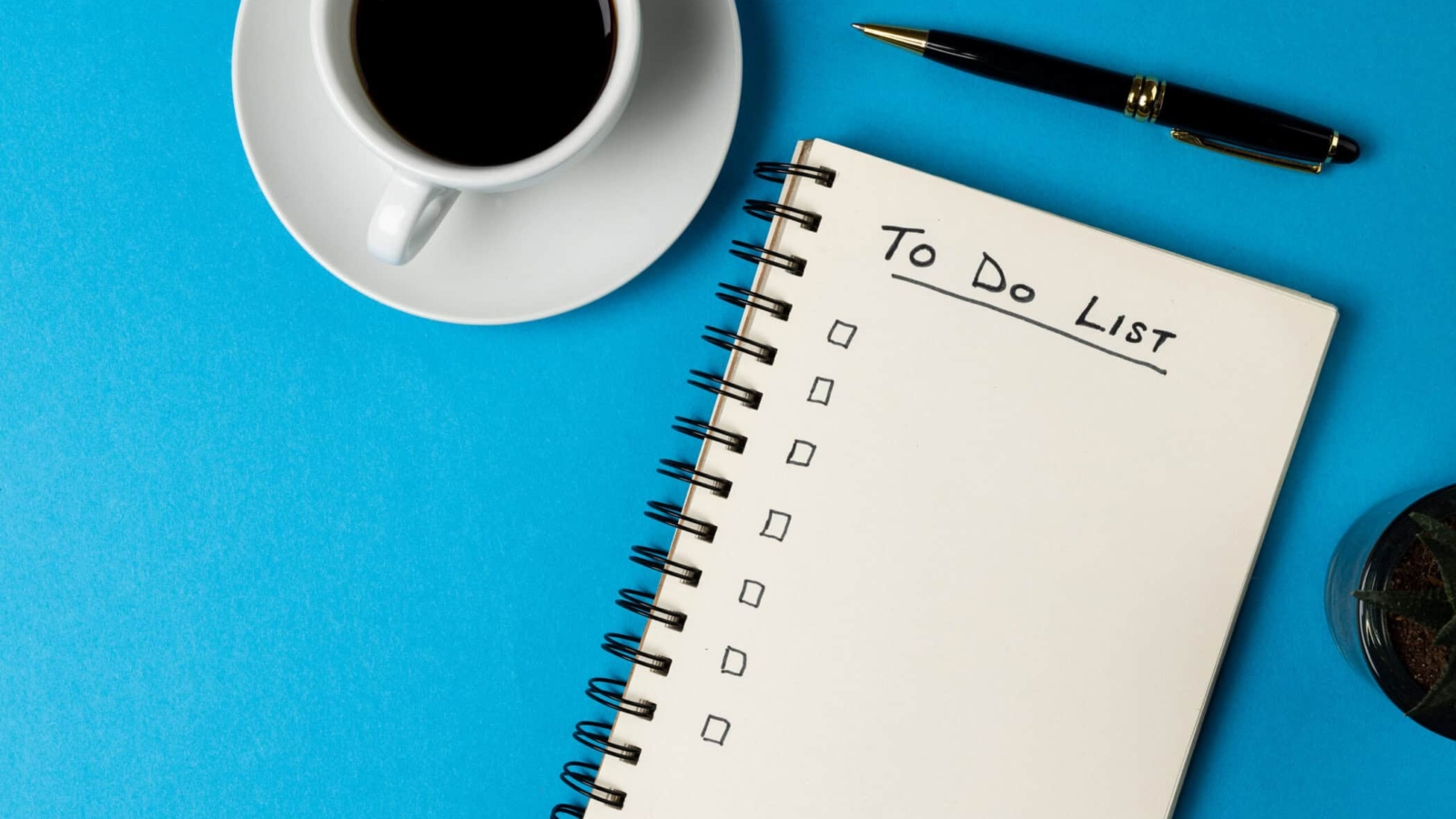 Image of notebook with to do list and copy space, coffee and pen on blue surface. Business, working in office, equipment and tools concept.